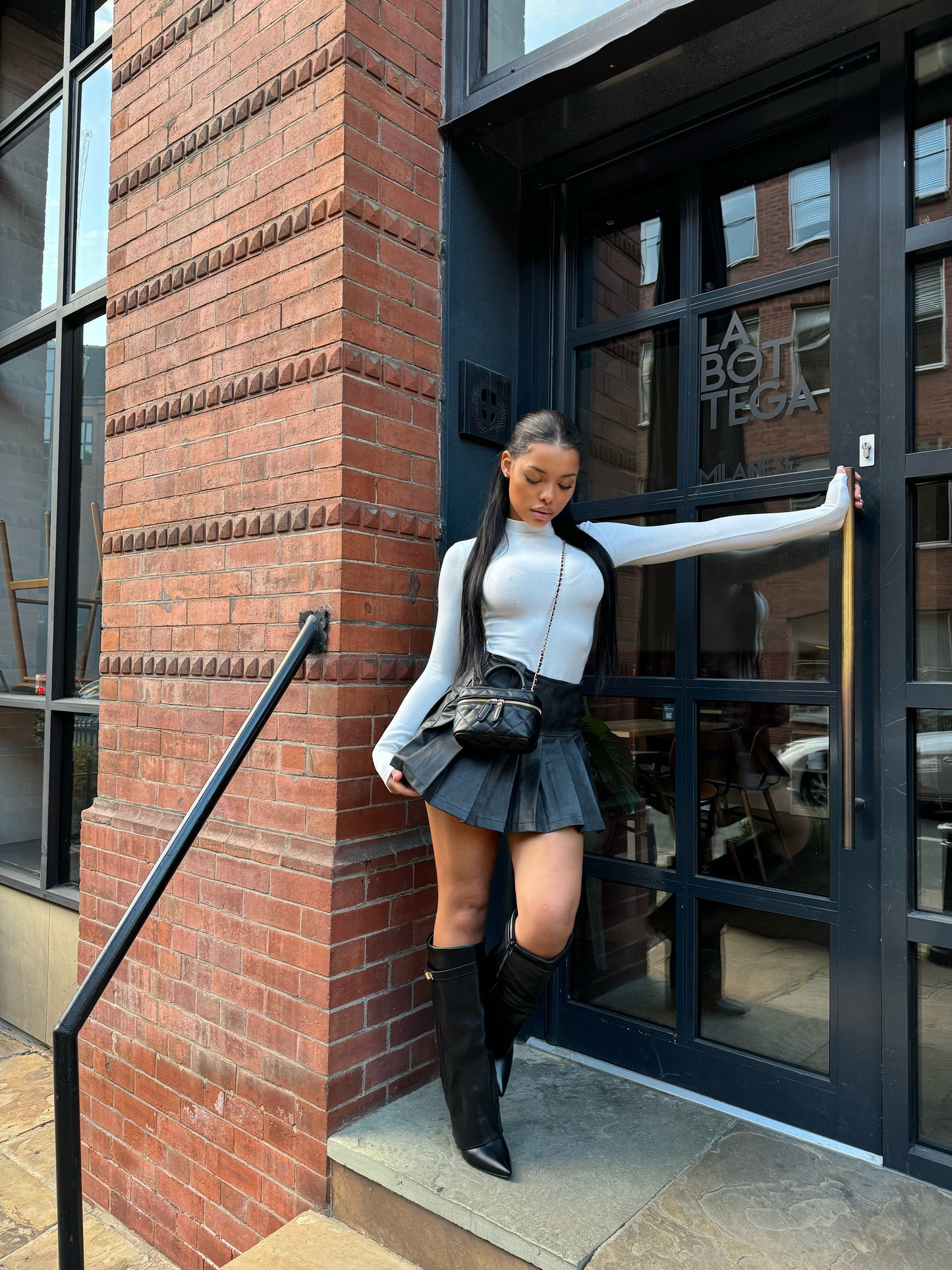 The ‘Raya’ Black Pleated Leather Mini Skirt